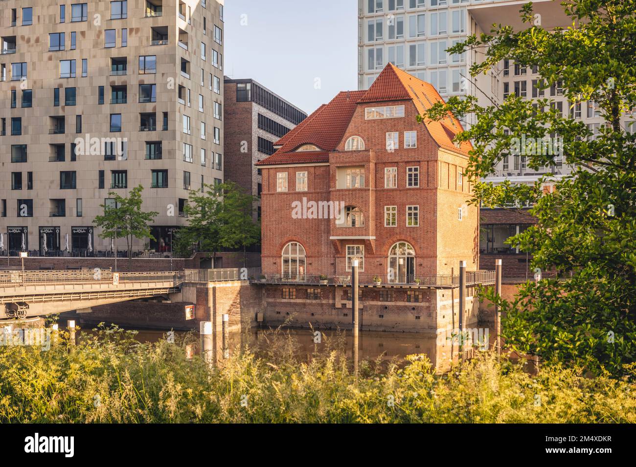Germany, Hamburg, Elbe river and brick house on Ericusspitze street Stock Photo