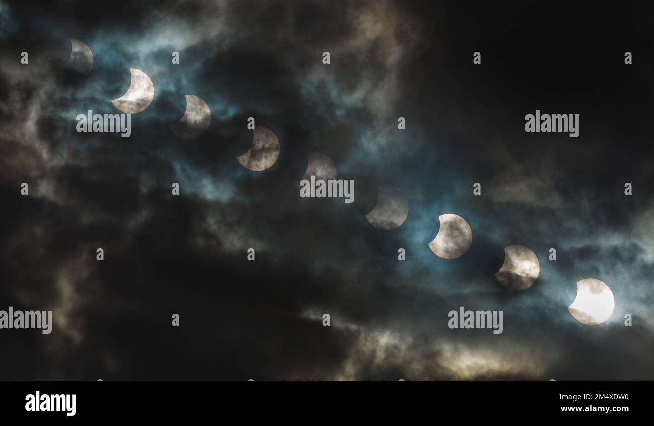Solar Eclipse On The Cloudy Background Eclipse Of The Sun At The solar-eclipse-on-the-cloudy-background-eclipse-of-the-sun-at-the