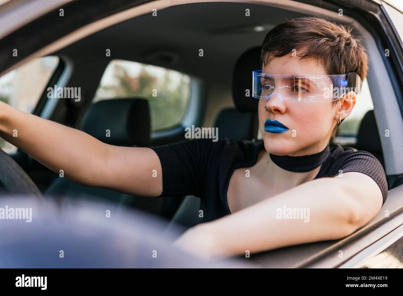 Woman wearing smart glasses driving car Stock Photo Alamy