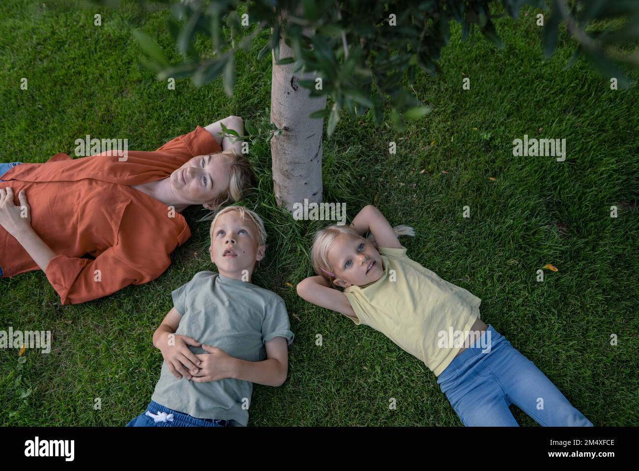 Group children lying on grass hi-res stock photography and images - Alamy