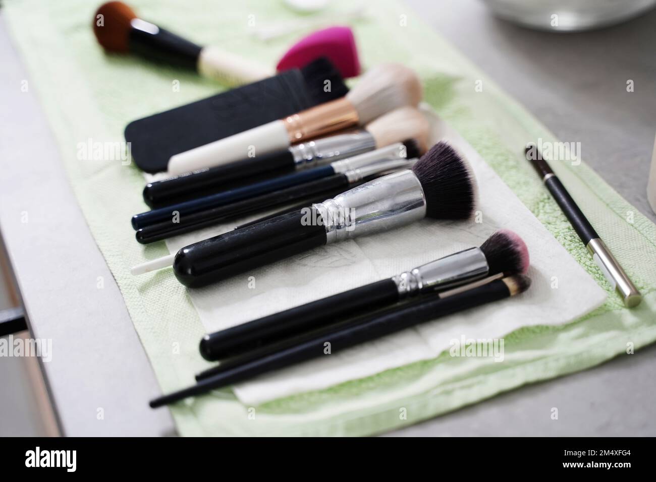 Make-up brushes on table in salon Stock Photo