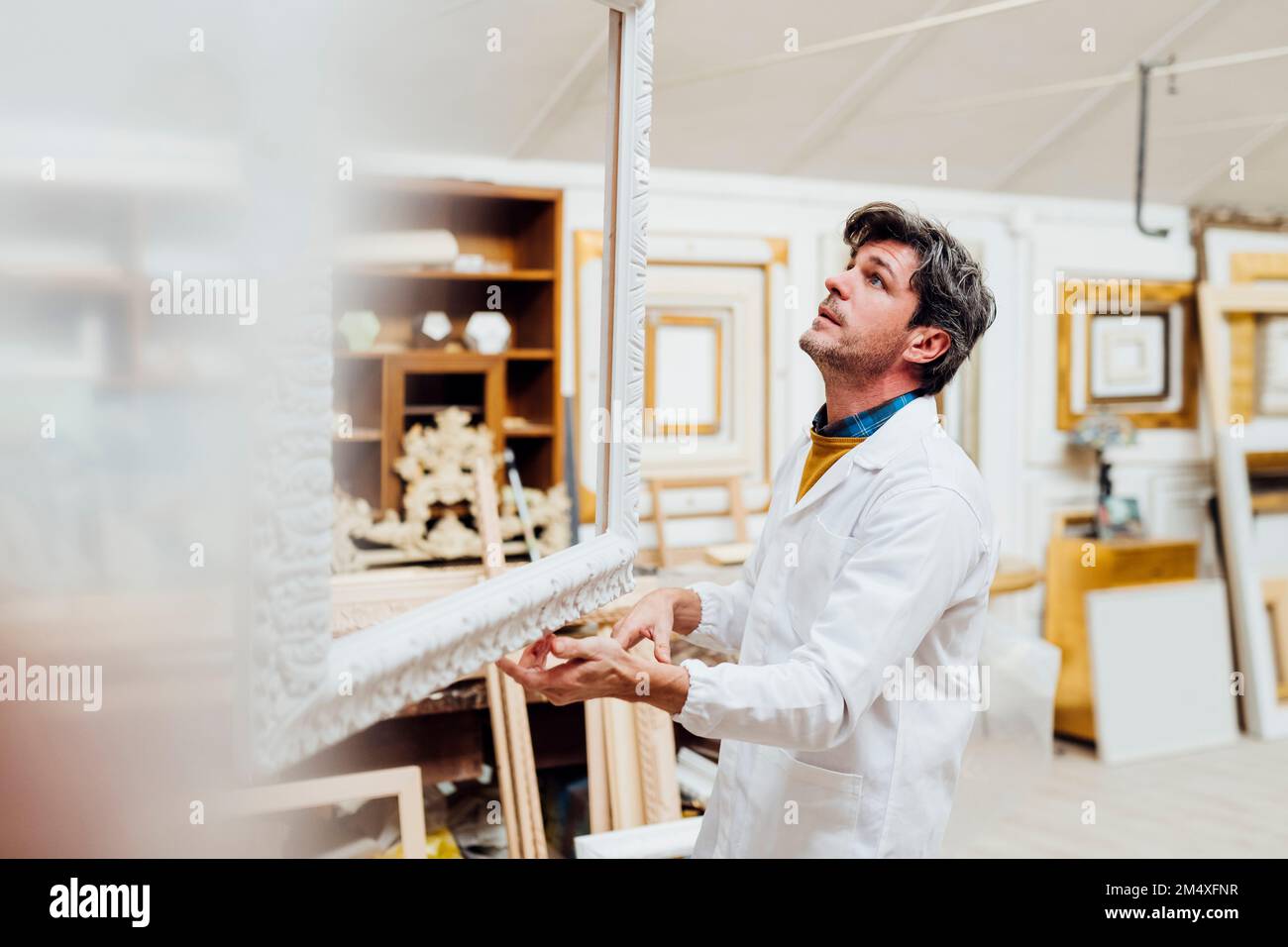 Mature carpenter working in workshop Stock Photo