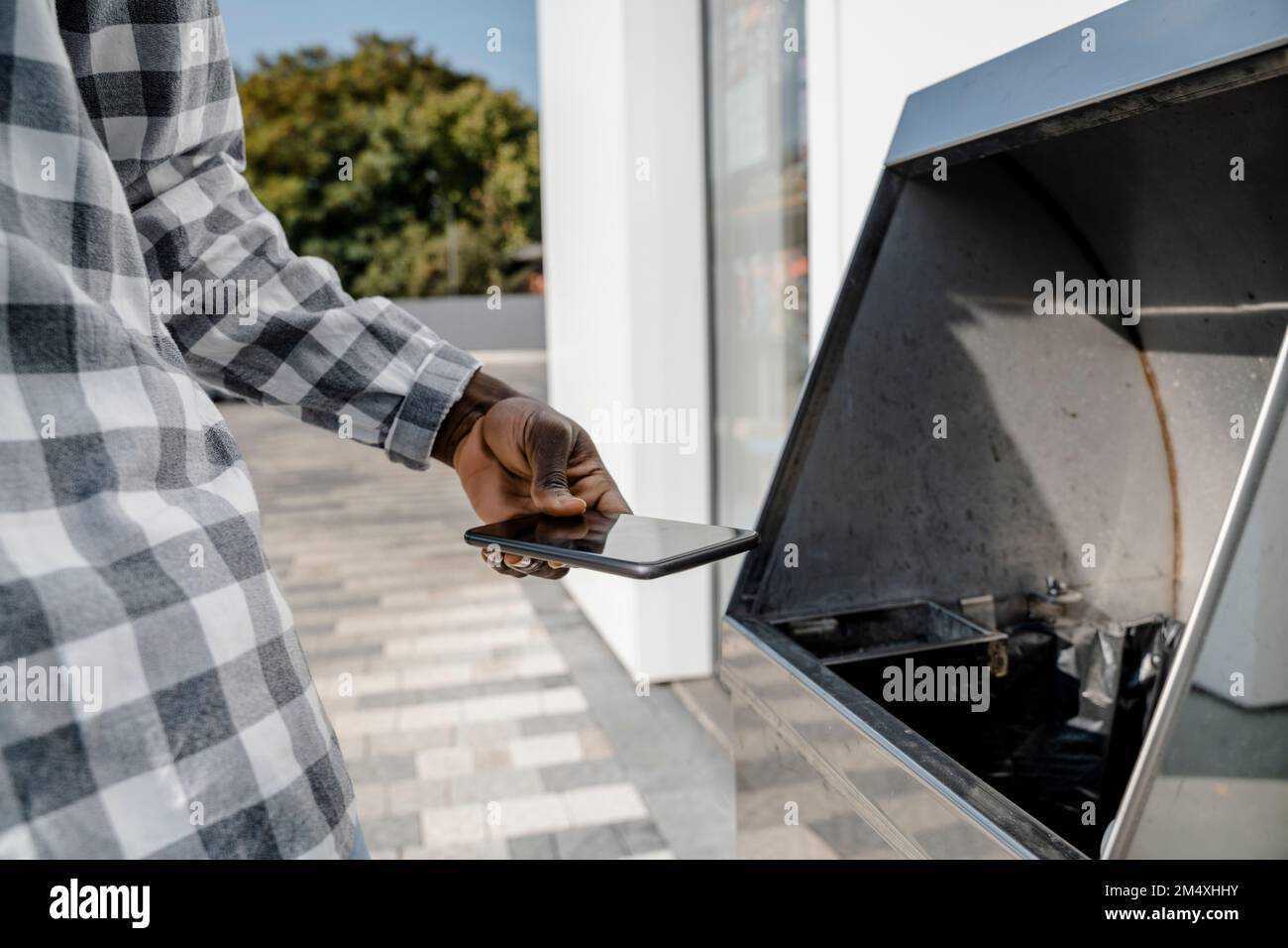Person throwing away garbage hires stock photography and images Alamy