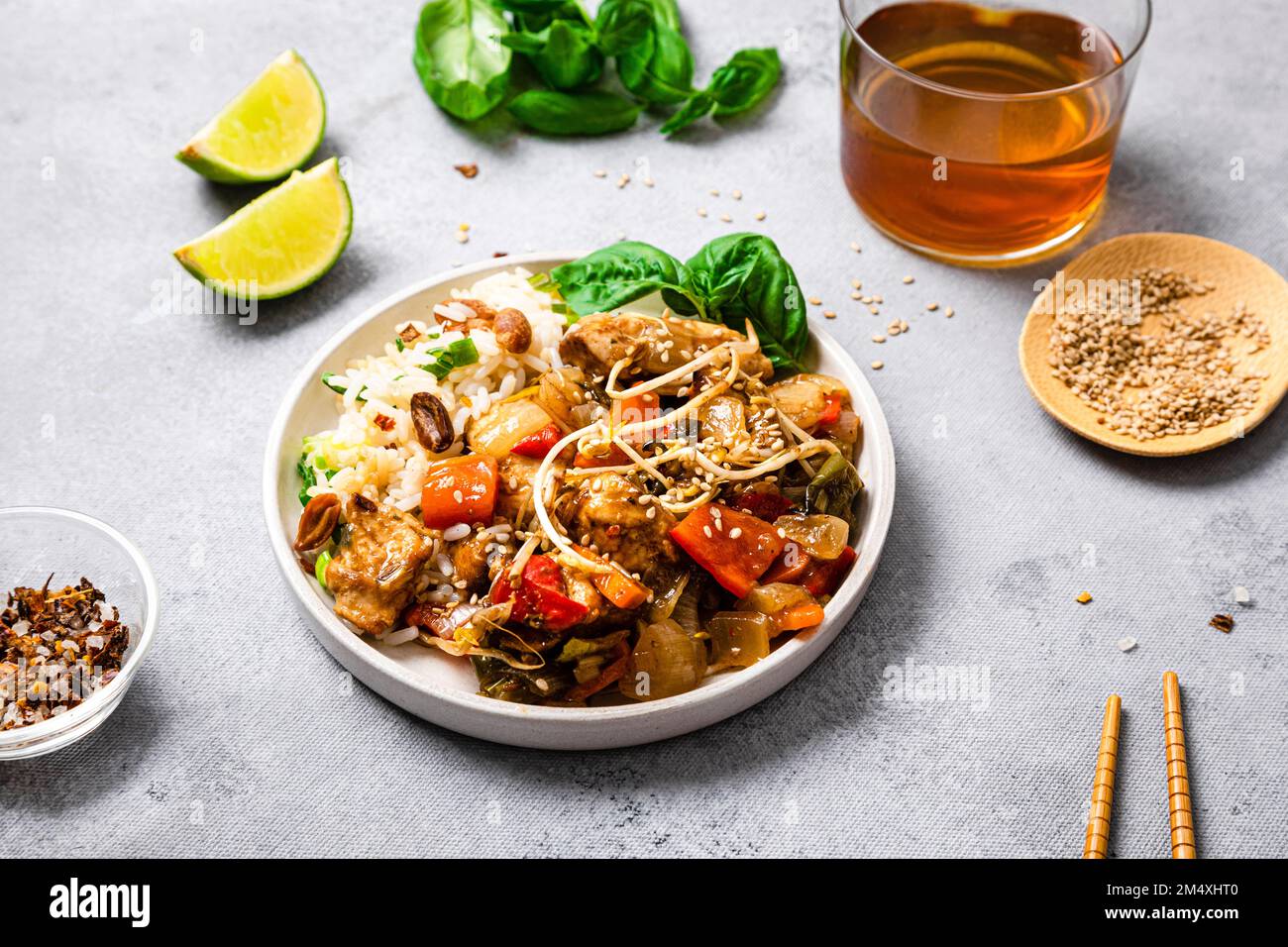 Plate of chicken chop suey with basil and sesame seeds Stock Photo