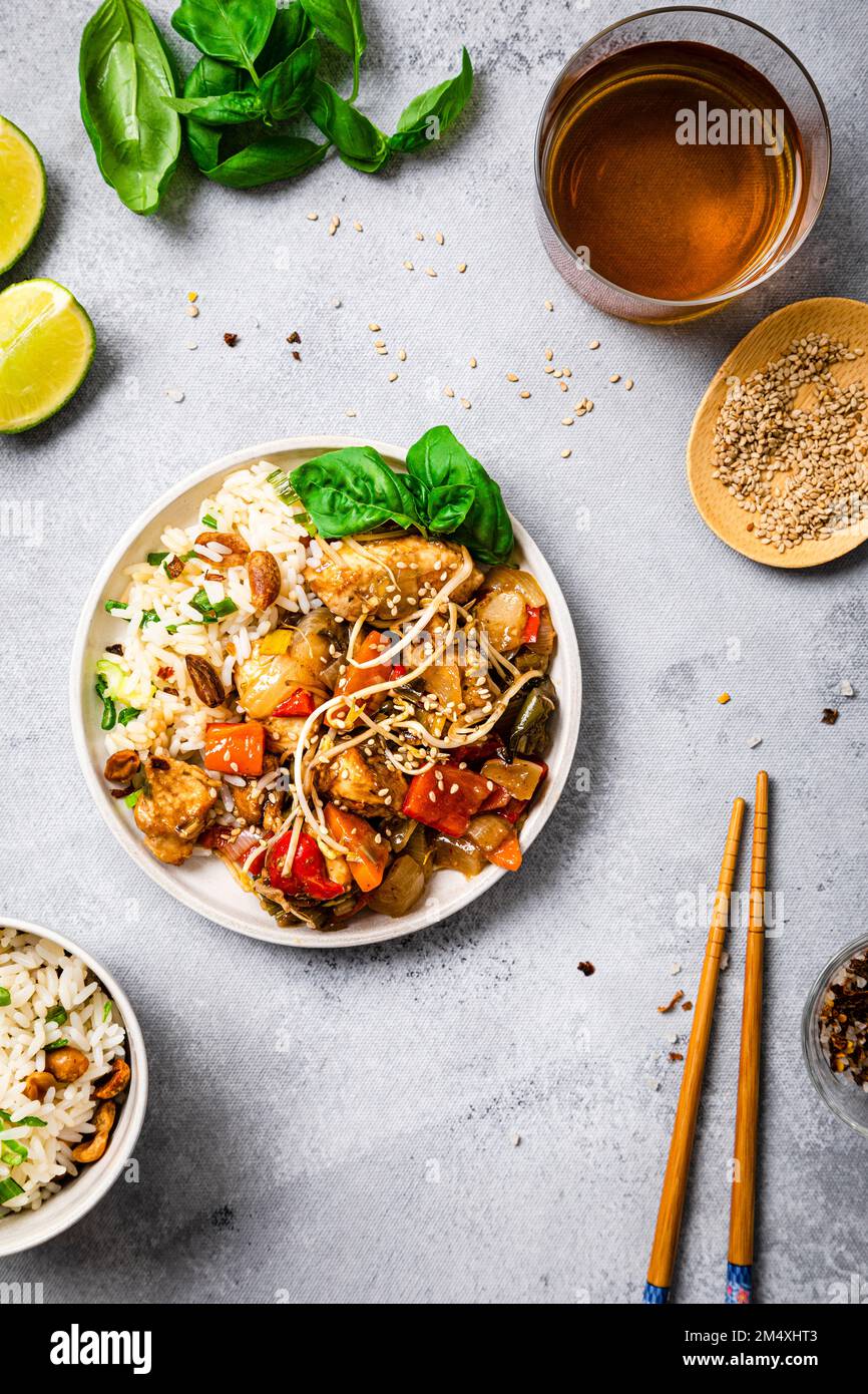 Plate of chicken chop suey with basil and sesame seeds Stock Photo