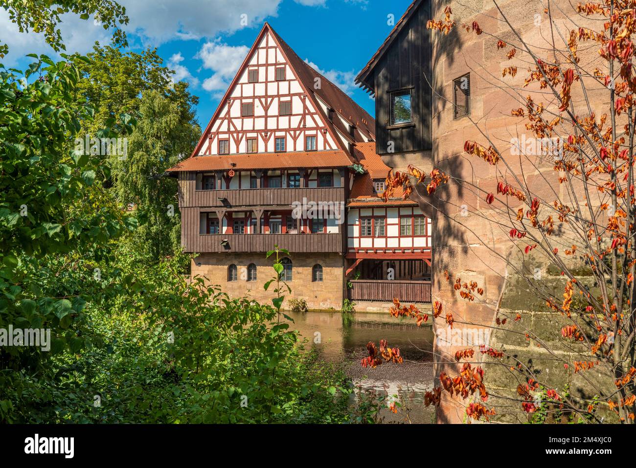 Germany, Bavaria, Nuremberg, Pegnitz river with historic Weinstadel house in background Stock Photo