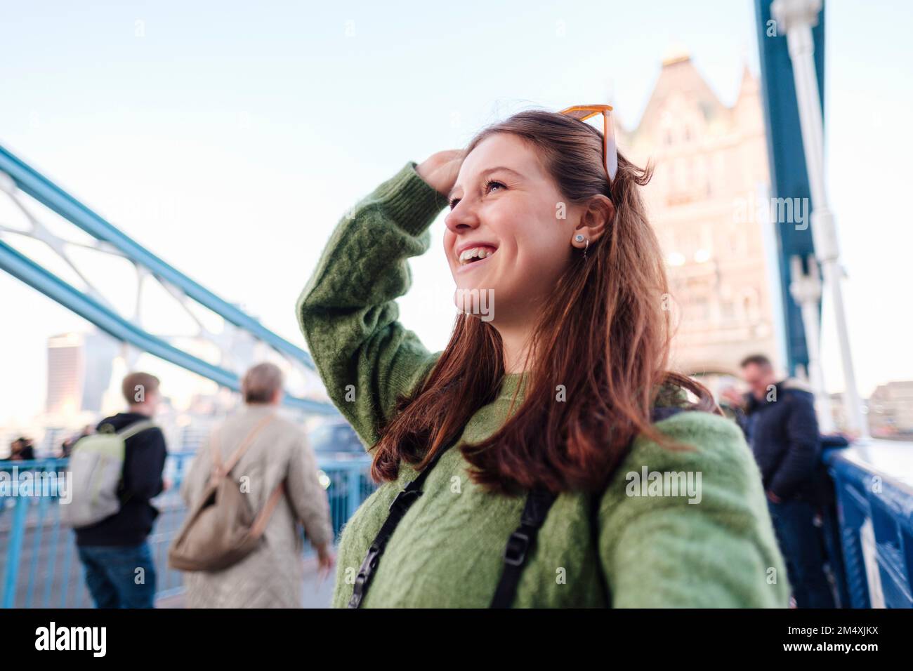 Happy young woman taking selfie on Tower Bridge, London, England Stock
