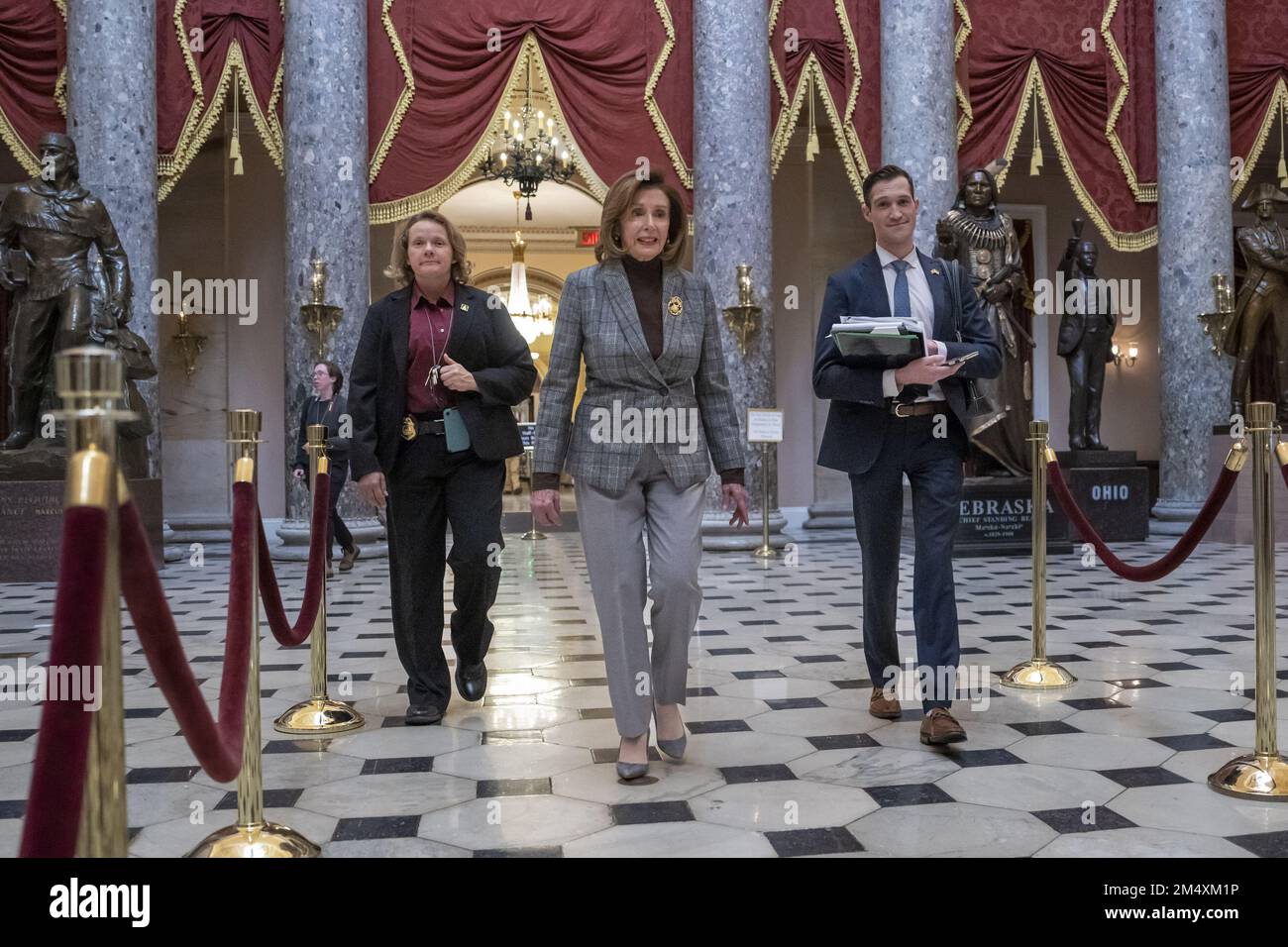 Washington DC, USA. 23rd Dec, 2022. Speaker of the United States House of Representatives Nancy Pelosi D-CA., walks from the House Floor to her office on Capitol Hill in Washington, DC on Friday, December 23, 2022. 'The House of Representatives are debating legislation consisting of a $1.7 trillion spending package to fund the government through 2023.' Photo by Ken Cedeno/UPI Credit: UPI/Alamy Live News Stock Photo