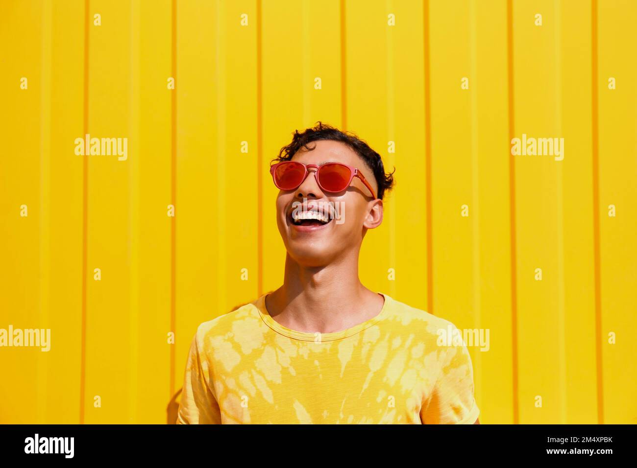 Young happy man in sunglasses hi-res stock photography and images - Alamy