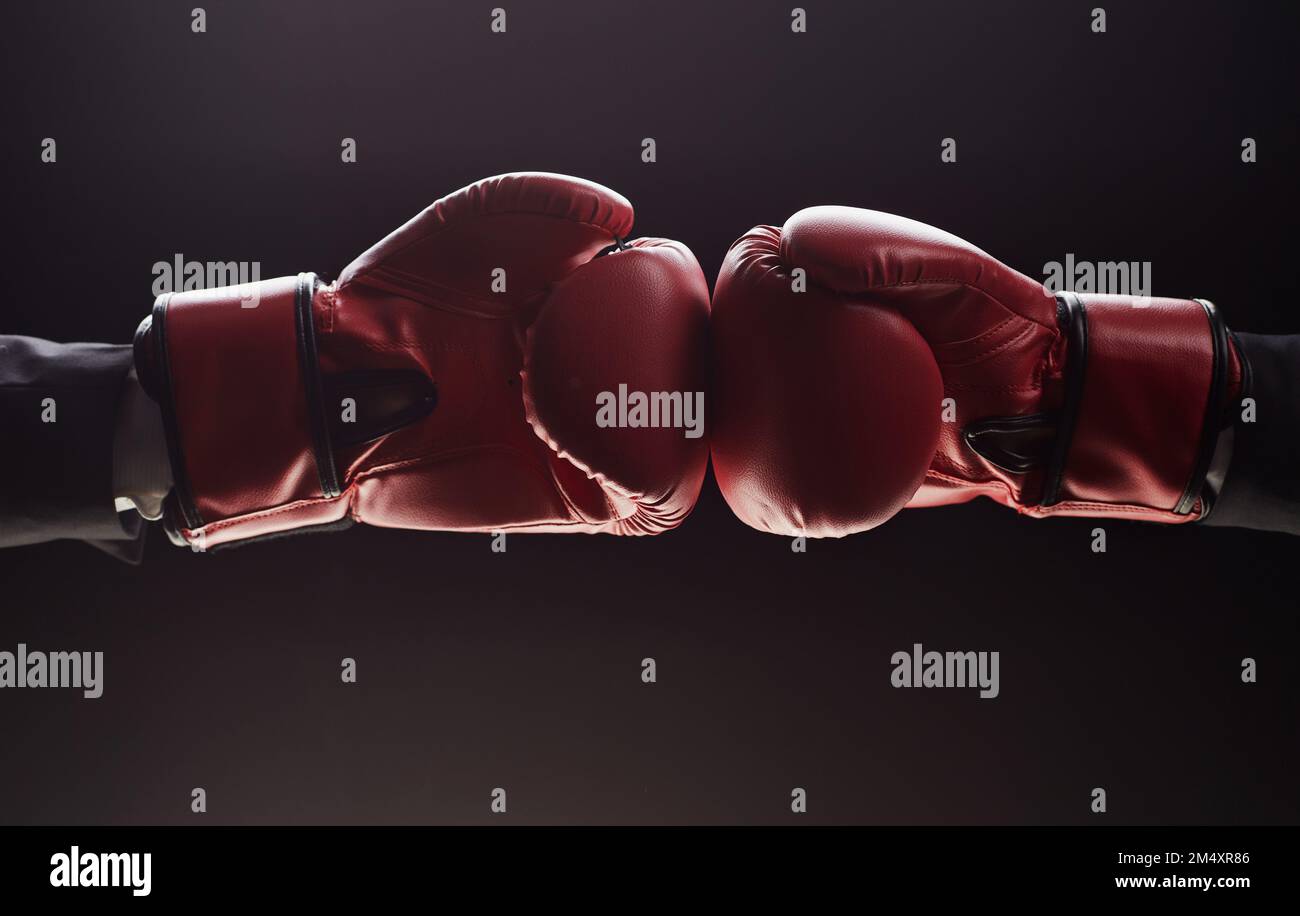 Two men's hands in boxing gloves. Confrontation concept Stock Photo