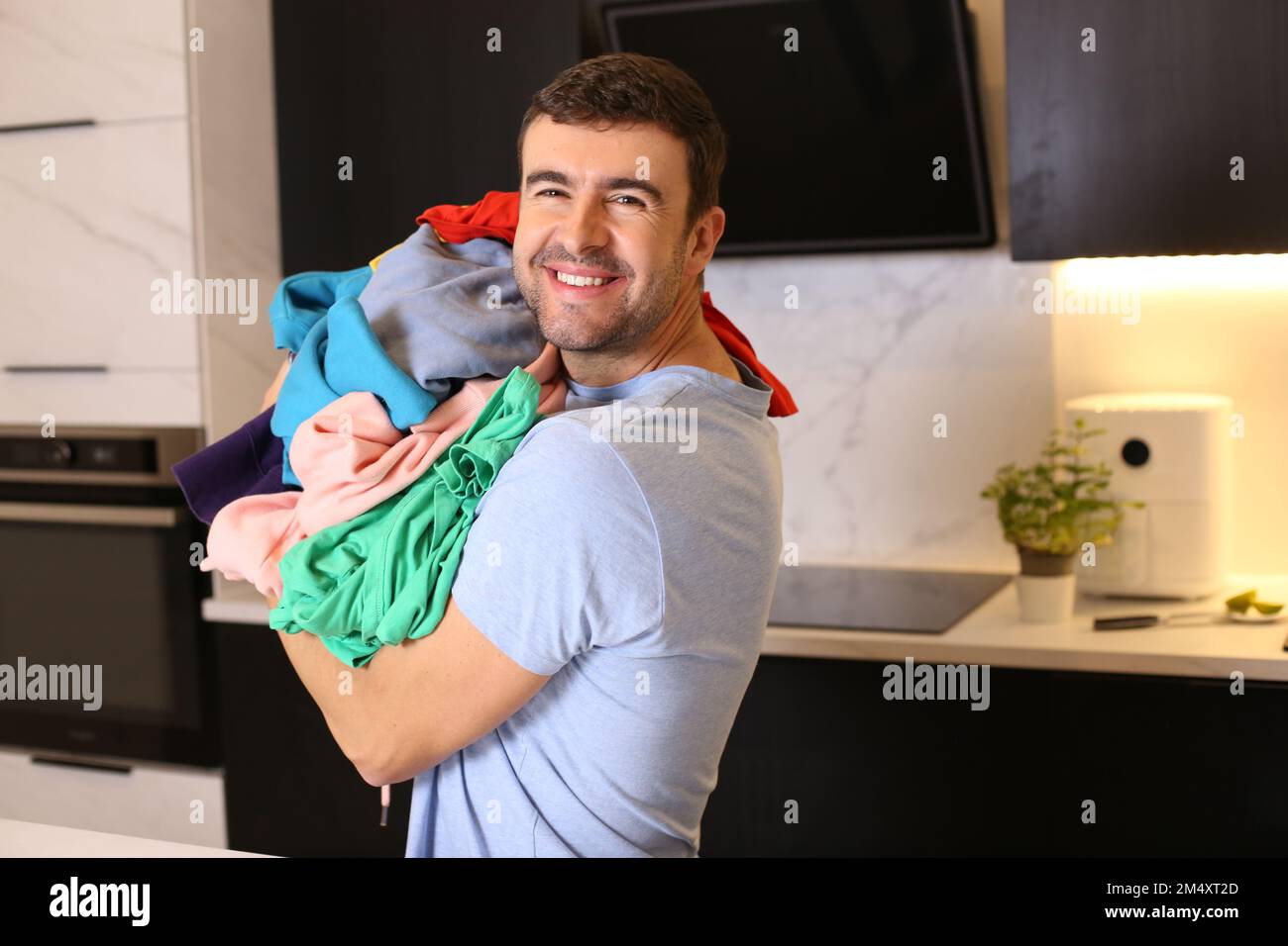Cute man doing the laundry Stock Photo