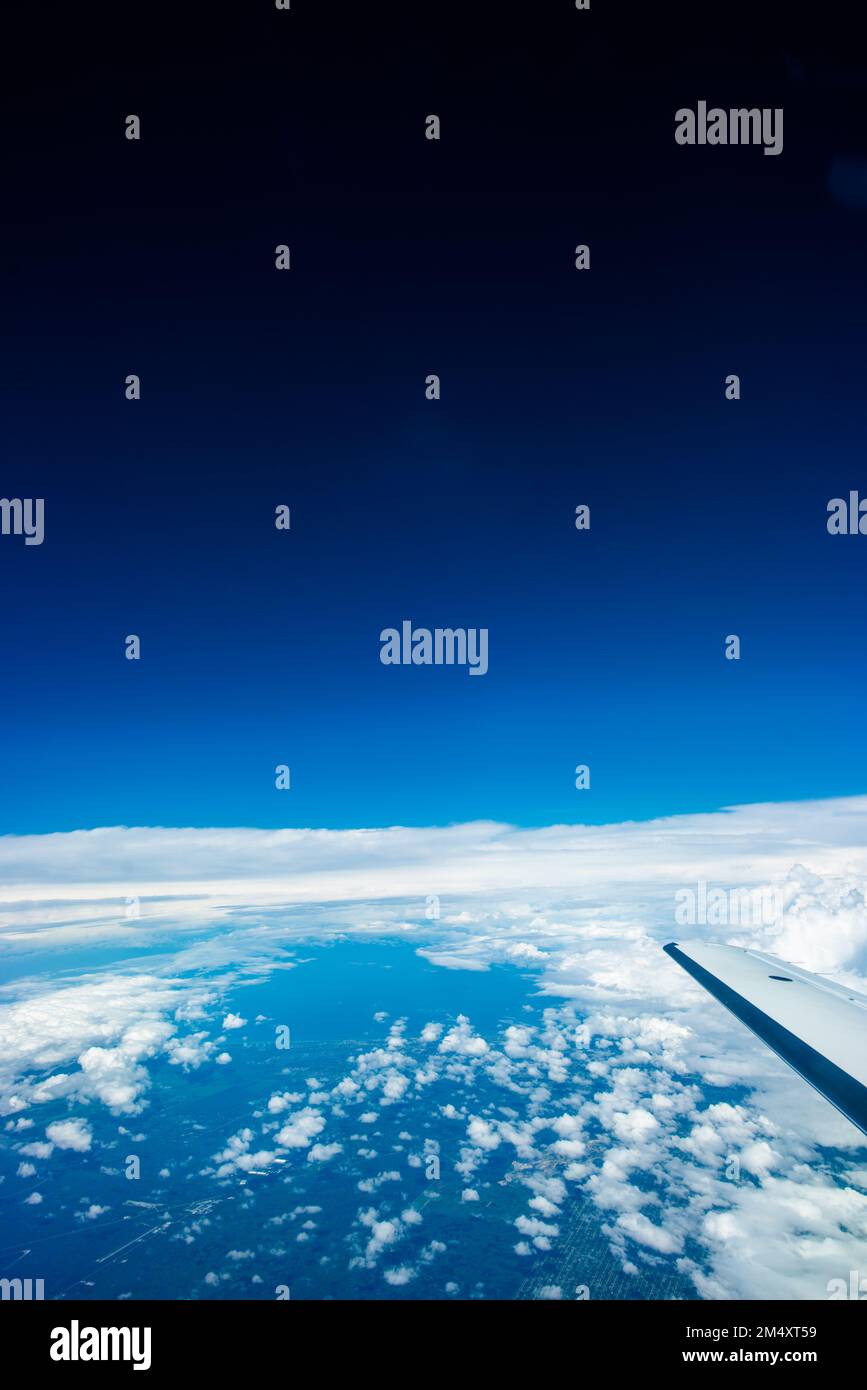 The beautiful view of the blue sky with white clouds from a plane ...