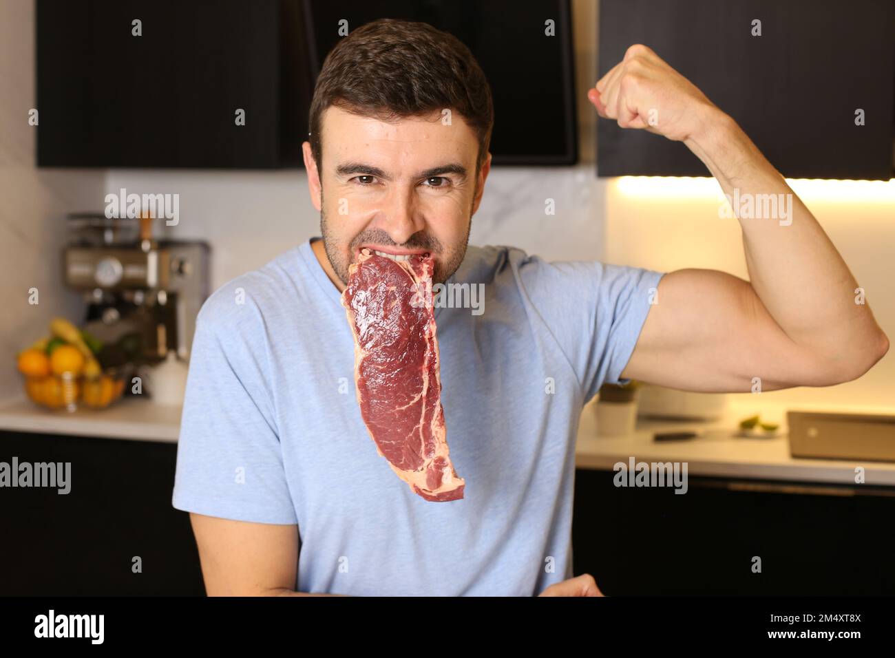 Meat lover showing a delicious raw steak Stock Photo Alamy