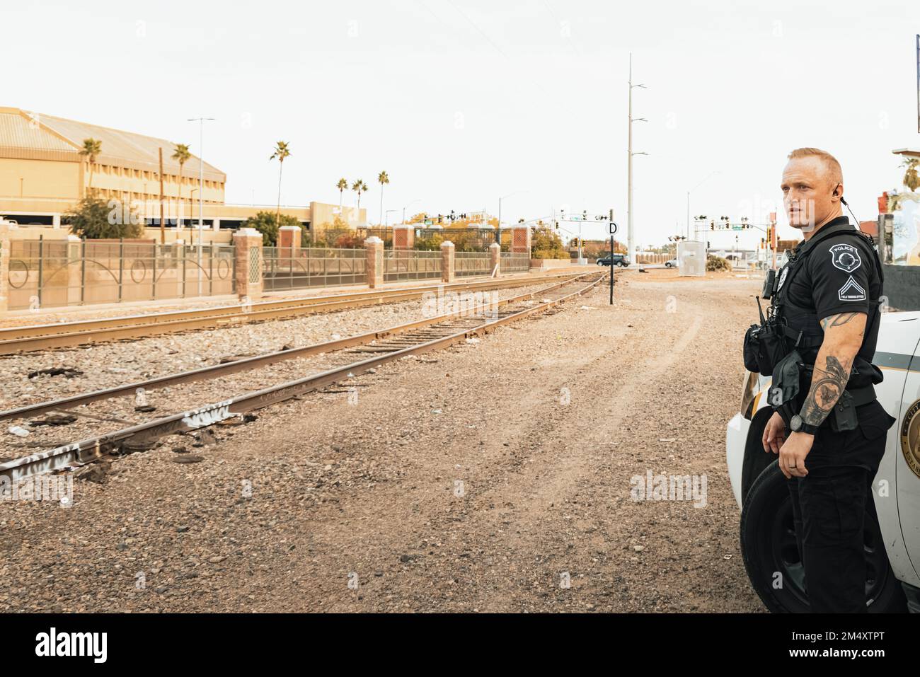 Horizontal image of white male caucasian police officer standing next