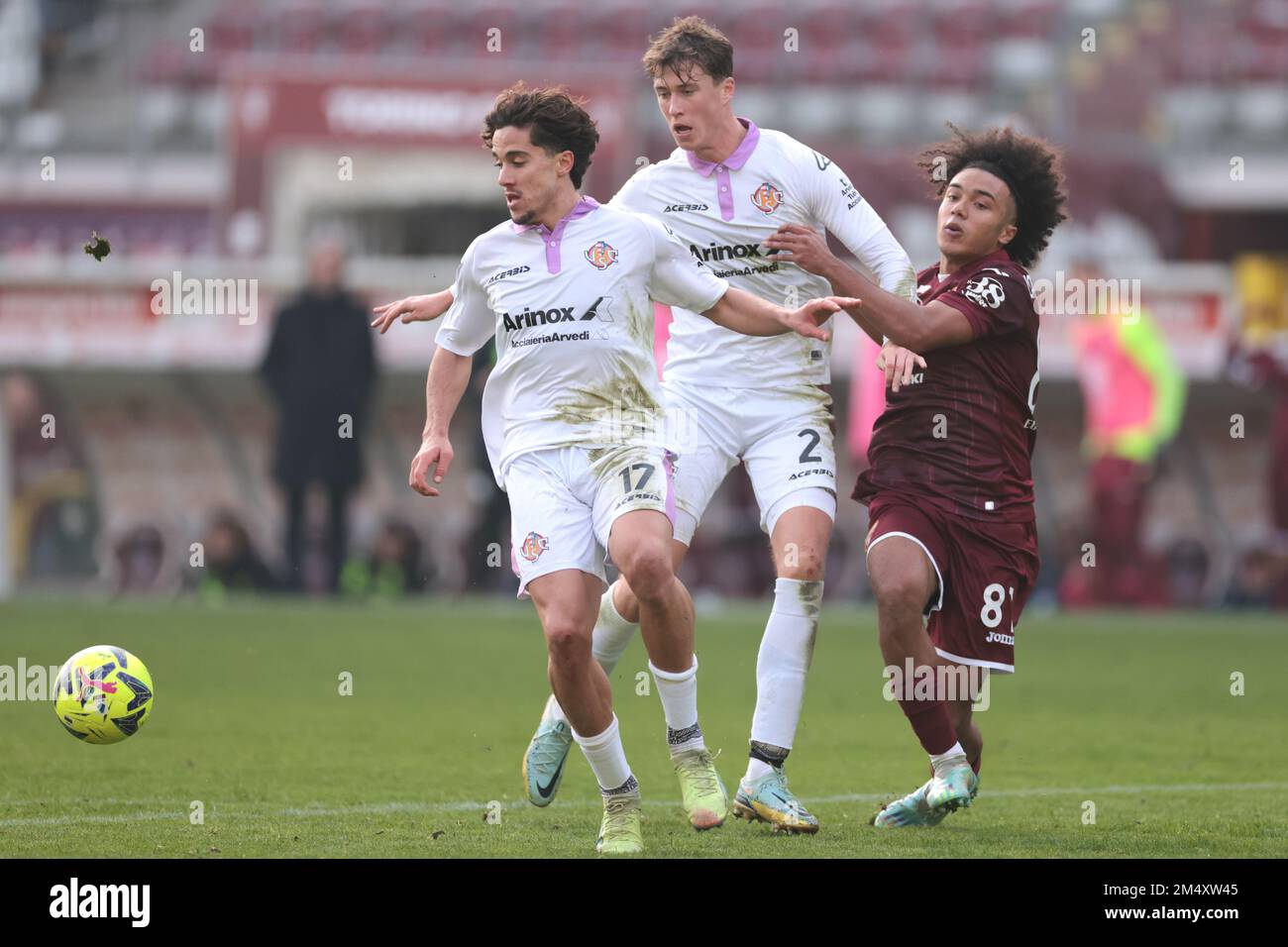 Turin, Italy, 23rd December 2022. Jack Hendry of US Cremonese and Leonardo Sernicola of US Cremonese clash with Aaron Ciammaglichella of Torino FC during the Friendly match match at Stadio Grande Torino, Turin. Picture credit should read: Jonathan Moscrop / Sportimage Credit: Sportimage/Alamy Live News Stock Photo