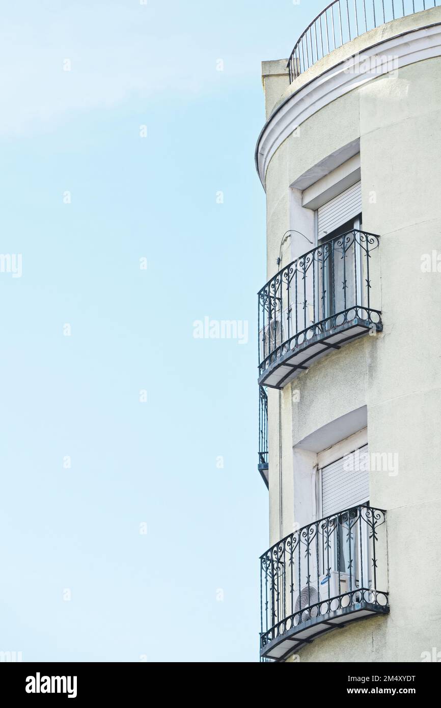 Facade of a building with balconies with artistic wrought iron railings ...