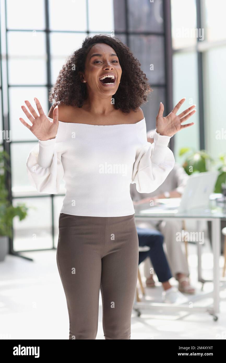 Portrait of a young attractive African American woman in the office ...