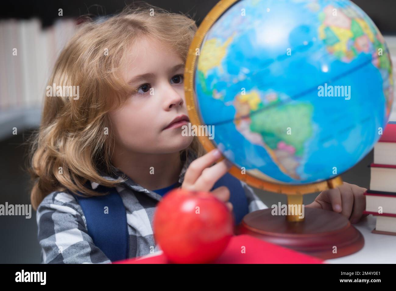 School kid student learning, study language or literature at school. Elementary school child. Portrait of nerd pupil studying. Stock Photo