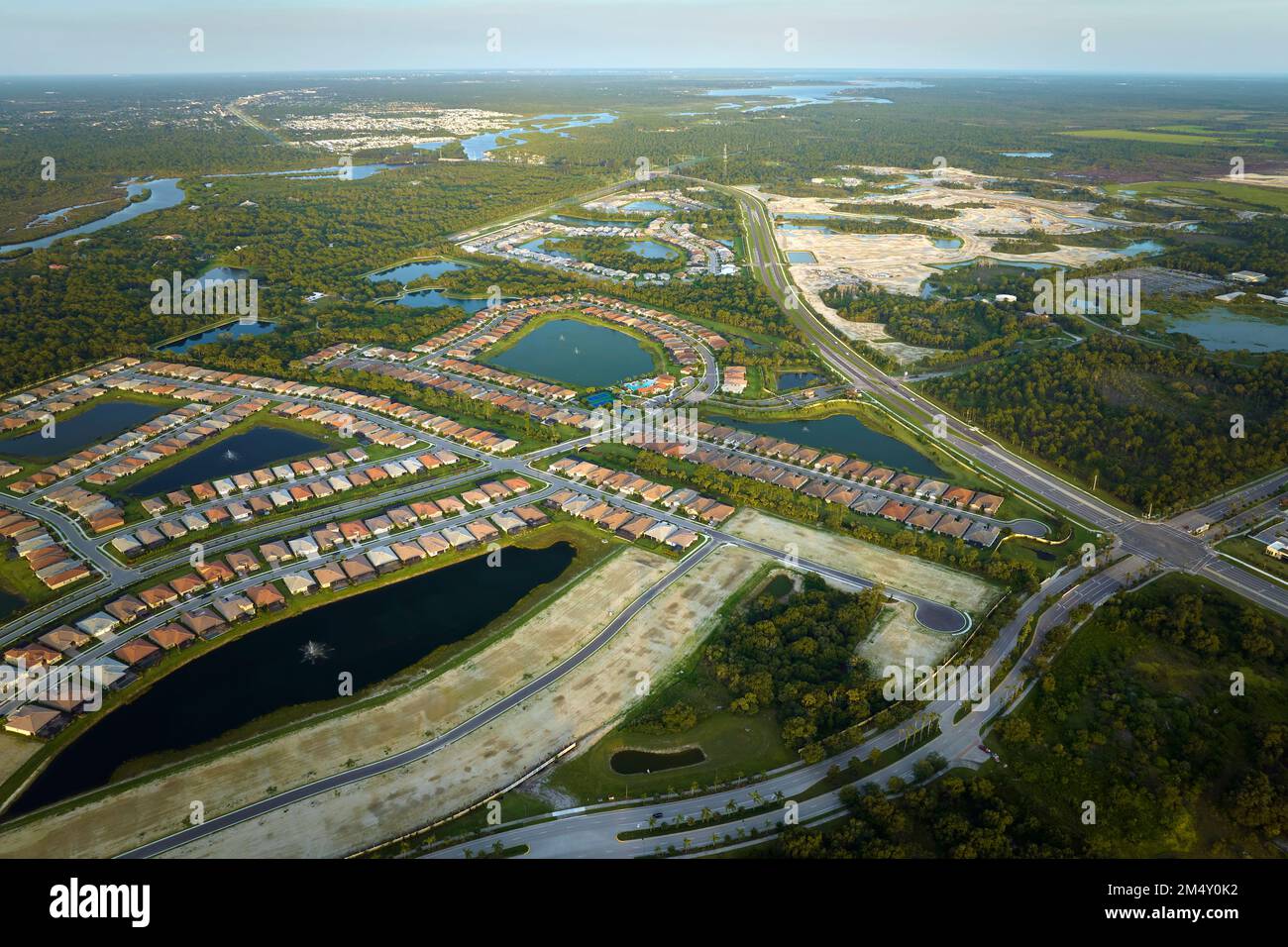 Aerial view of construction site with new tightly packed homes in