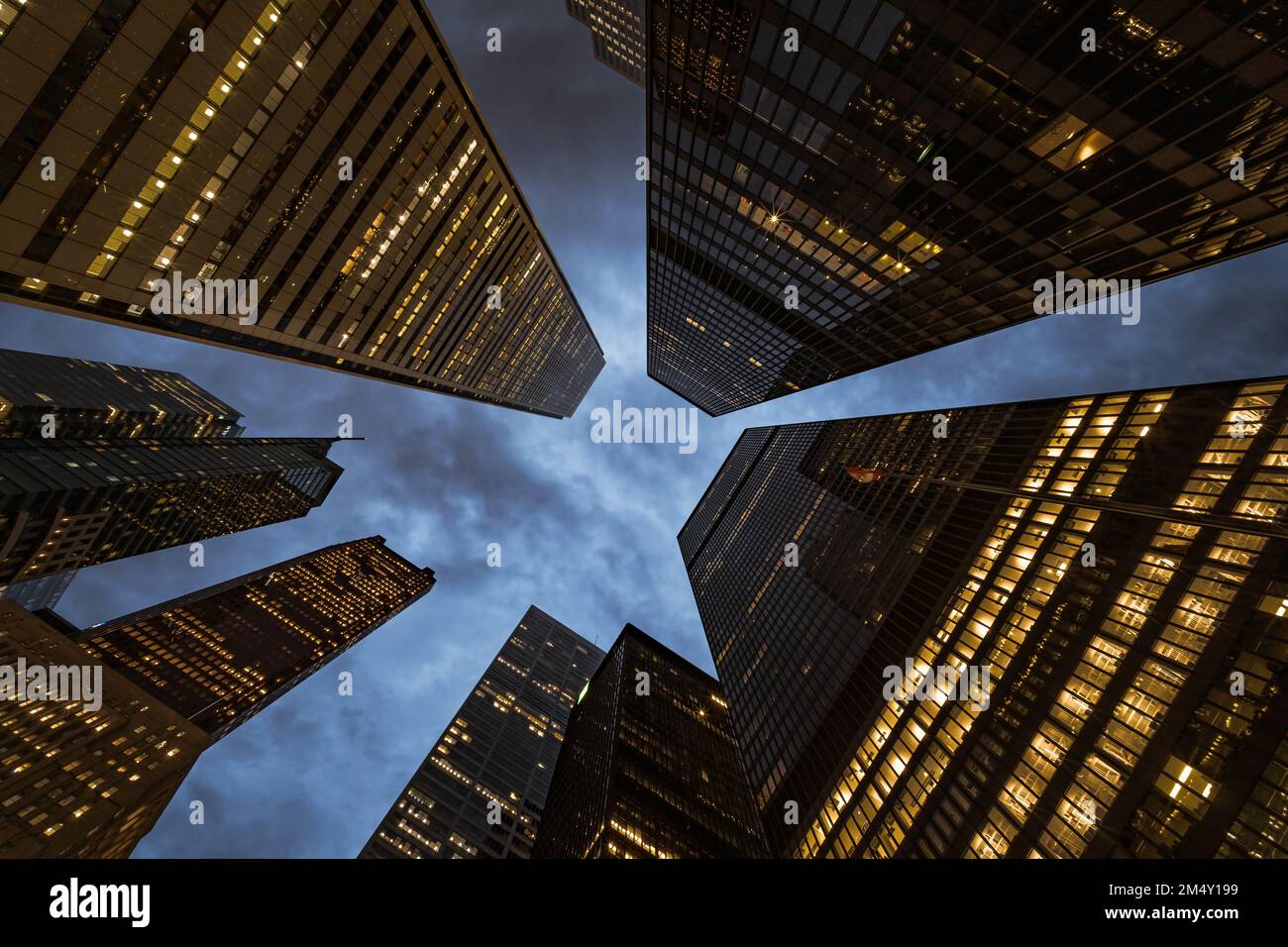 Business and finance concept, looking up at modern corporate buildings at dusk in the financial district of Toronto, Ontario, Canada. Stock Photo