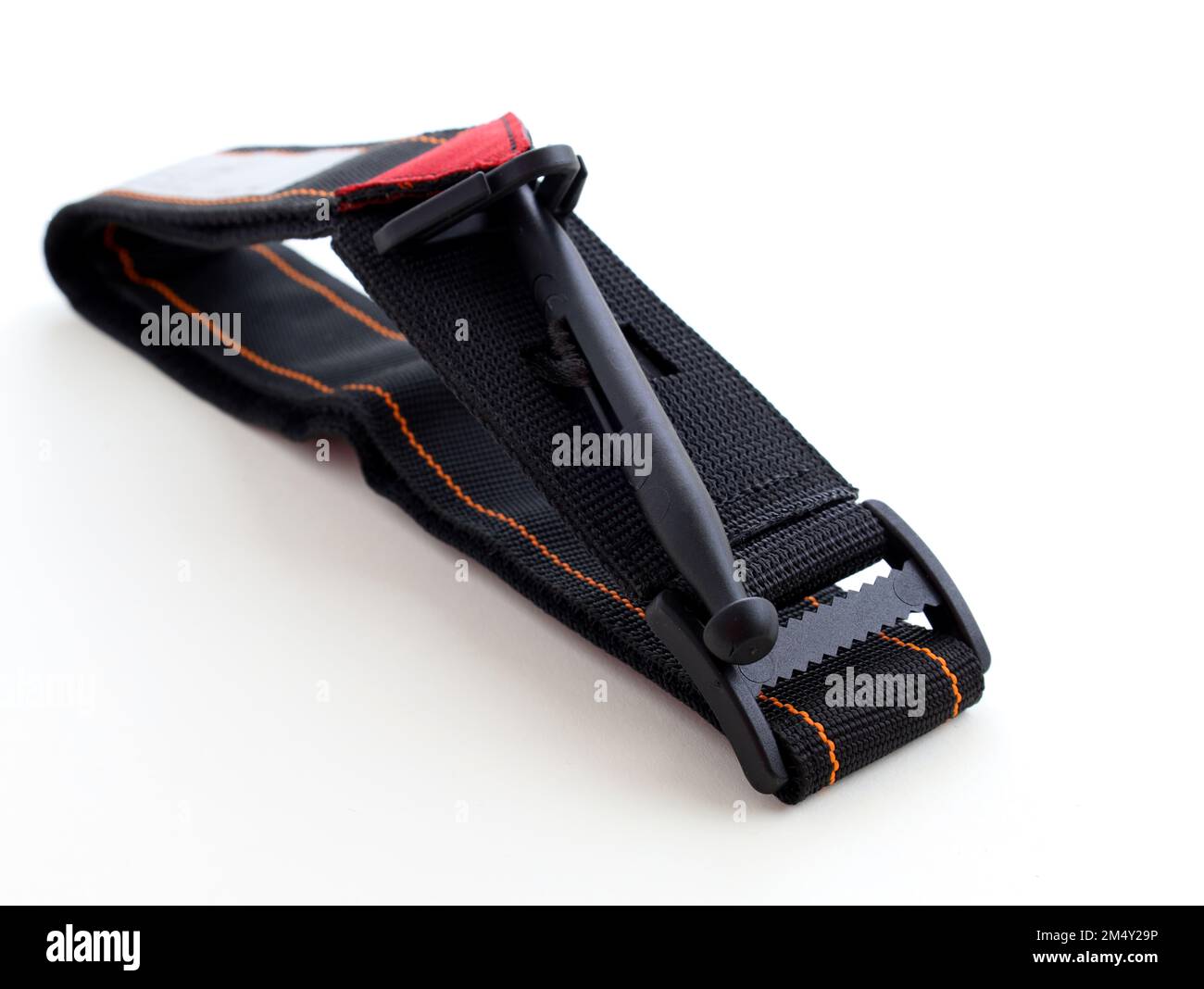 Hemostatic tourniquet on a white background top view. A tourniquet to