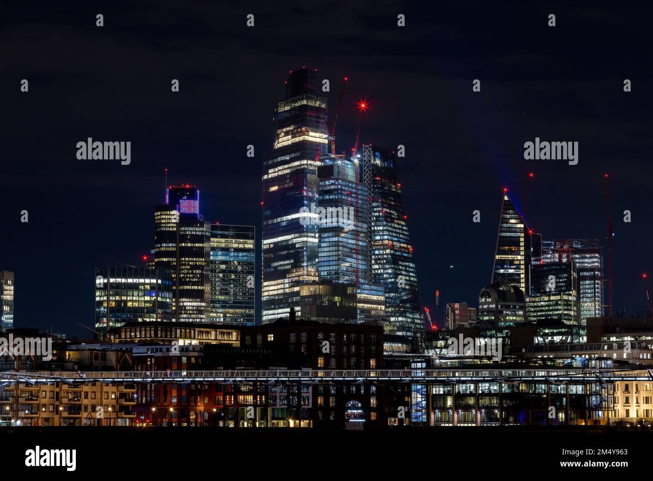 Beautiful view of the city of London by night, glittering skyscrapers across the river Thames Stock Photo