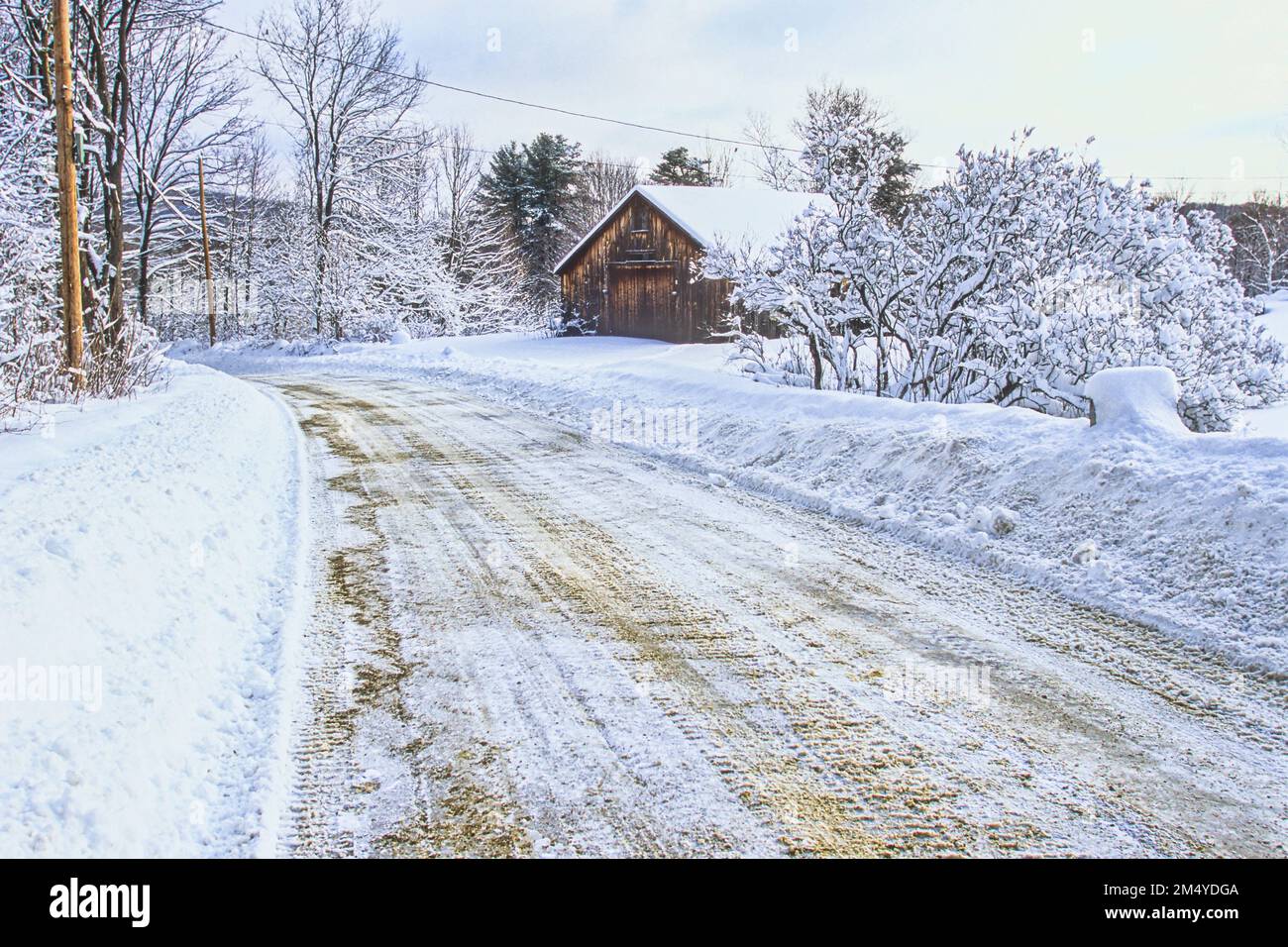 A country road covered with snow in Phillipston, MA Stock Photo