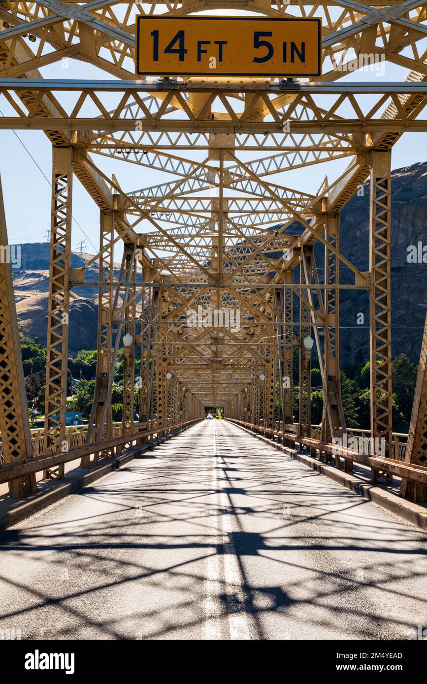 Steel structure of Grand Coulee Bridge casts abstract shadows on road