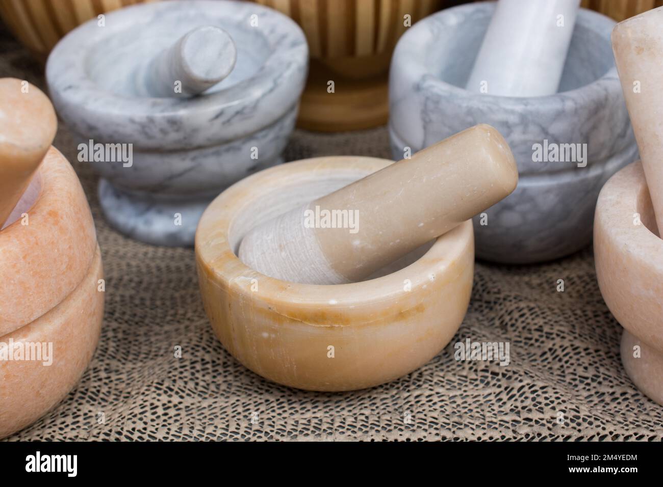 Wooden mortars and pestles as a traditional kitchenware Stock Photo Alamy