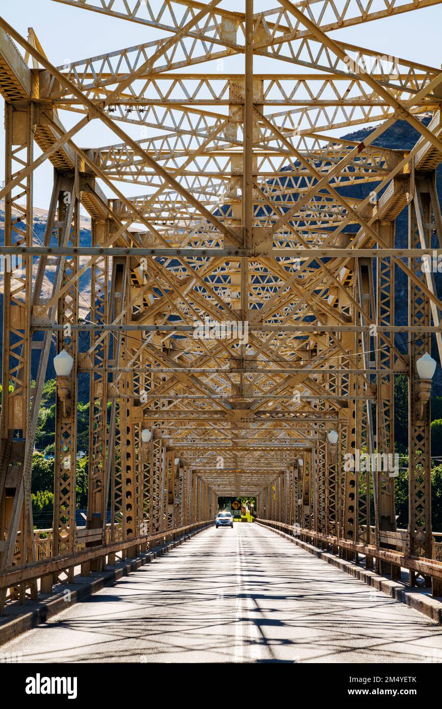 Steel structure of Grand Coulee Bridge casts abstract shadows on road