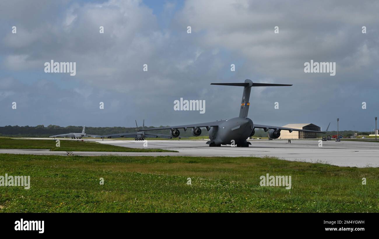 Two U.S. Air Force B-52 Stratofortresses and a U.S. Air Force C-17 Globemaster III taxi on the flightline at Andersen Air Force Base, Guam, Dec. 20, 2022. Pacific Air Forces’ force employment, military posture and operations honor our security commitments in the region by enabling us to rapidly respond to any potential crisis or challenge in the Indo-Pacific region. (U.S. Air Force photo by Airman 1st Class Kaitlyn Fronk) Stock Photo