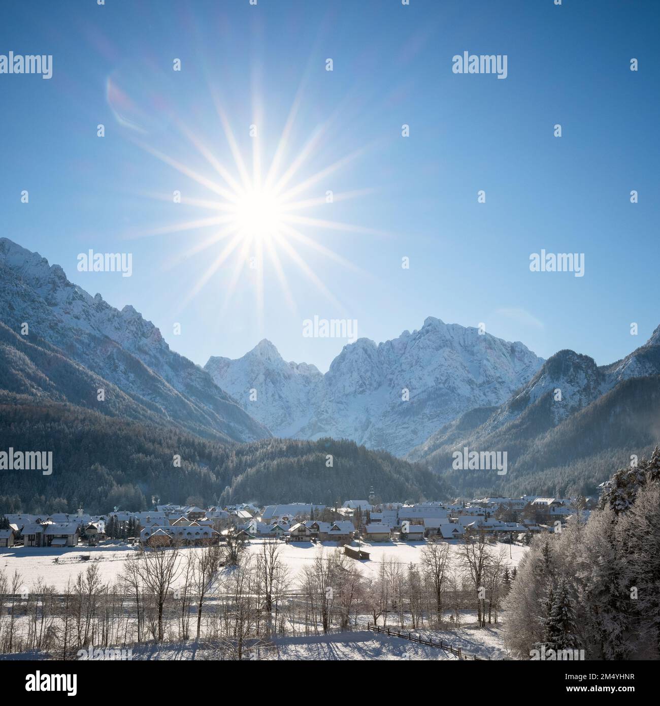 Kranjska Gora in Slovenia covered in snow at winter with Julian Alps and Triglav National Park in the background Stock Photo