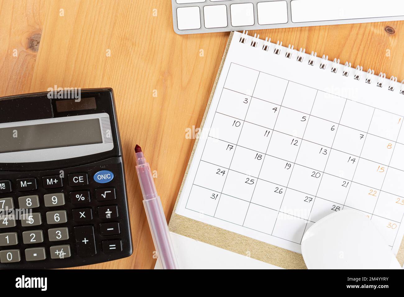 Calendar and agenda reminders, work from home online. desktop calendar with  stationery and pen pencil, keyboard. mark a holiday trip or plans in a dia  Stock Photo - Alamy