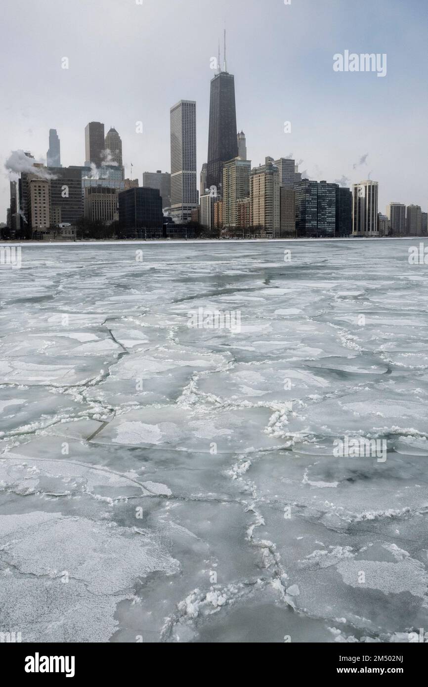 Chicago, USA.  23 December 2022.  Chicago weather : Ice pancakes in Lake Michigan on the second day of the winter storm in Chicago where temperatures are currently -20C. What has been termed a ‘bomb cyclone’, guaranteeing a white Christmas for many, is affecting large parts of the country with freezing temperatures.  Credit: Stephen Chung / Alamy Live News Stock Photo