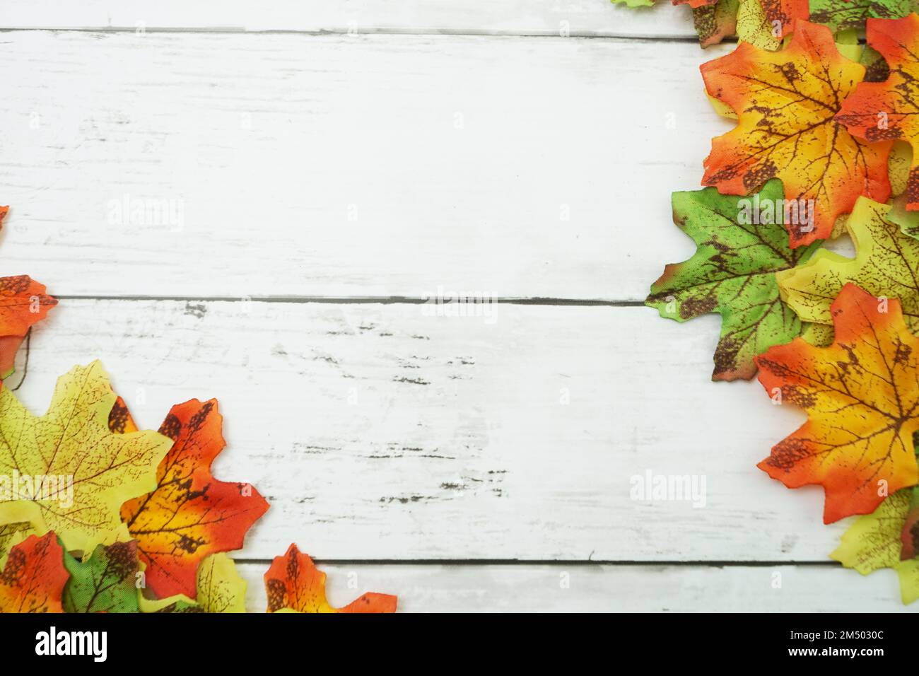 Autumn Maple leave border frame on wooden background Stock Photo - Alamy