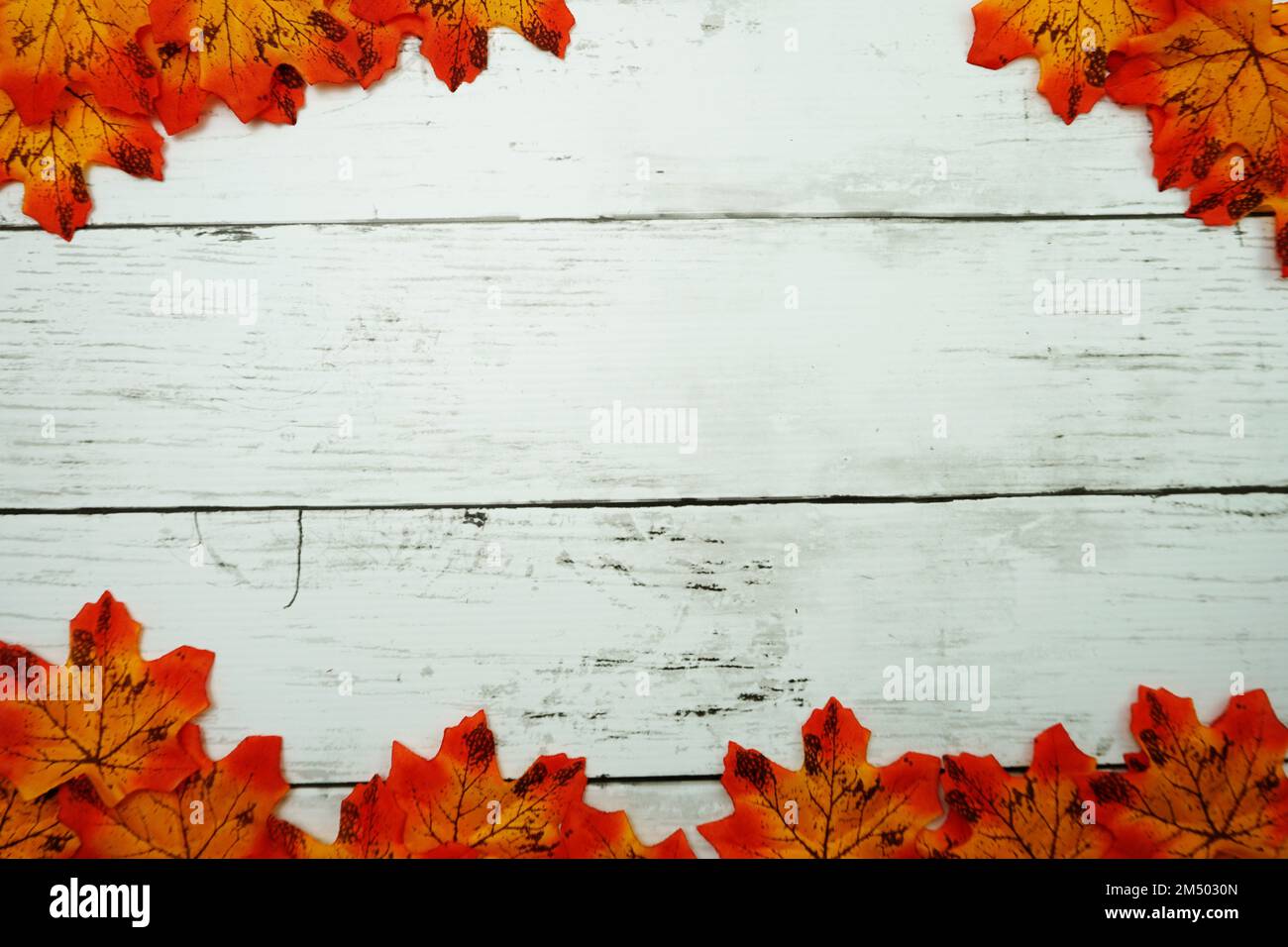 Autumn Maple leave border frame on wooden background Stock Photo - Alamy