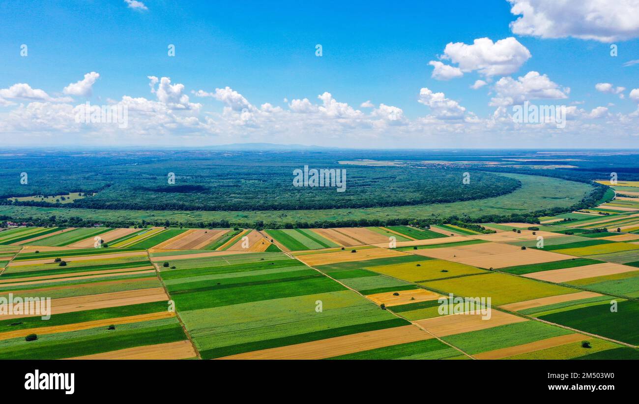 A drone shot of beautiful farmland with blue cloudy sky Stock Photo - Alamy