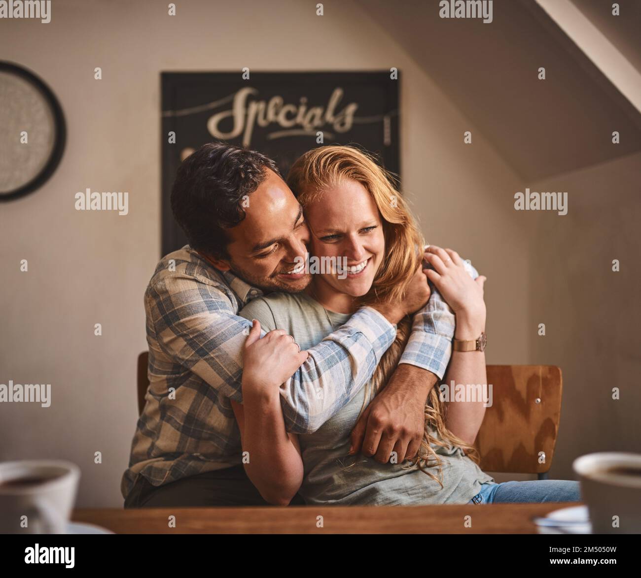 You are my happy place. a young couple spending time together at a cafe. Stock Photo