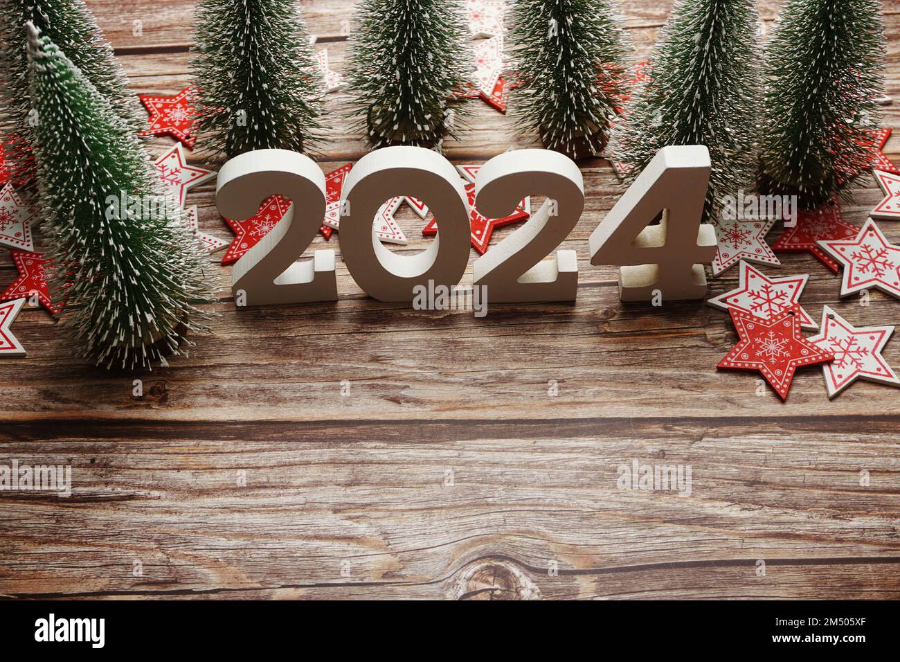 2024 Happy New Year and Christmas decoration on wooden background Stock  Photo - Alamy