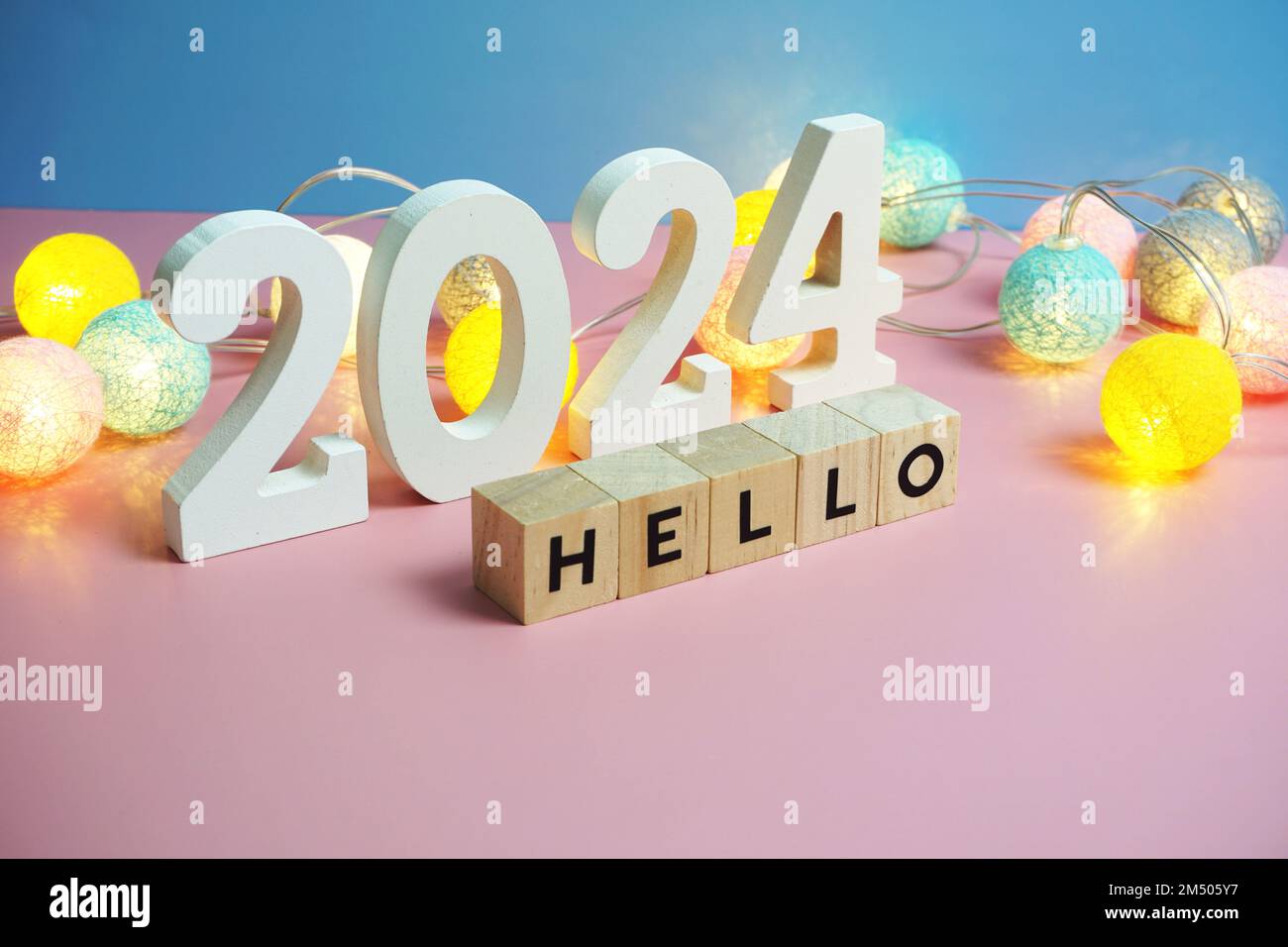 Hello 2024 word alphabet letters on pink and blue background Stock