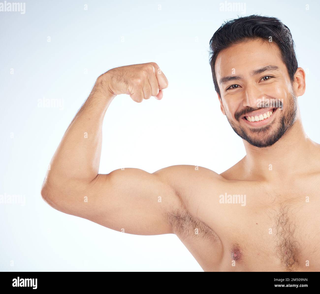 Portrait, fitness or man in studio to flex muscle or strong arms