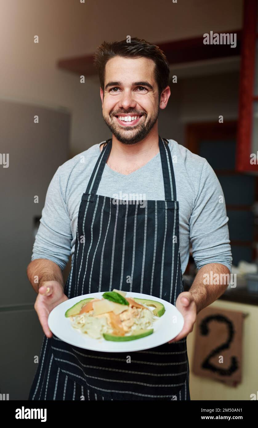 Dinner, is served. Cropped portrait of a handsome young man serving