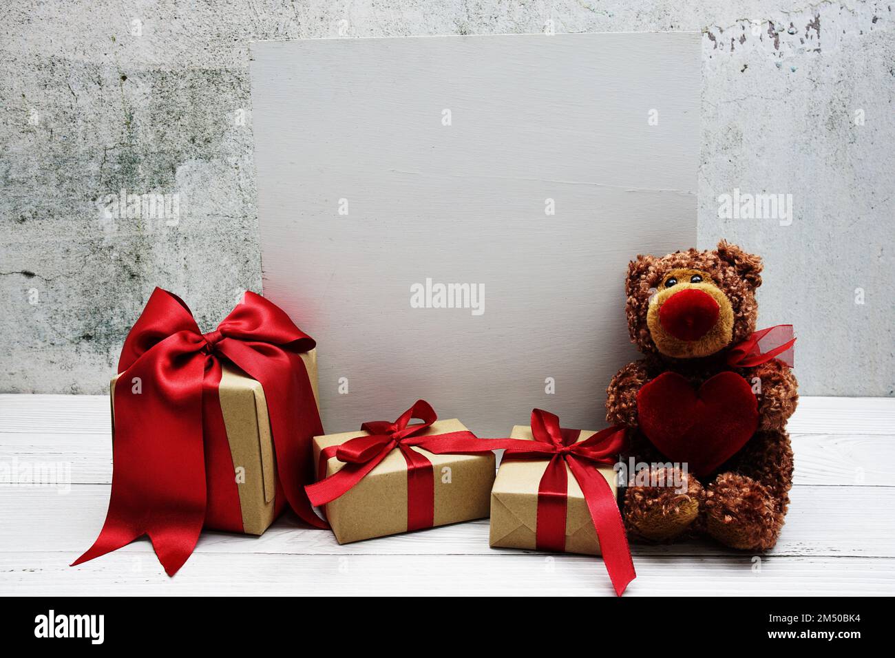 Teddy bear and gift boxes with space copy on wooden background Stock ...