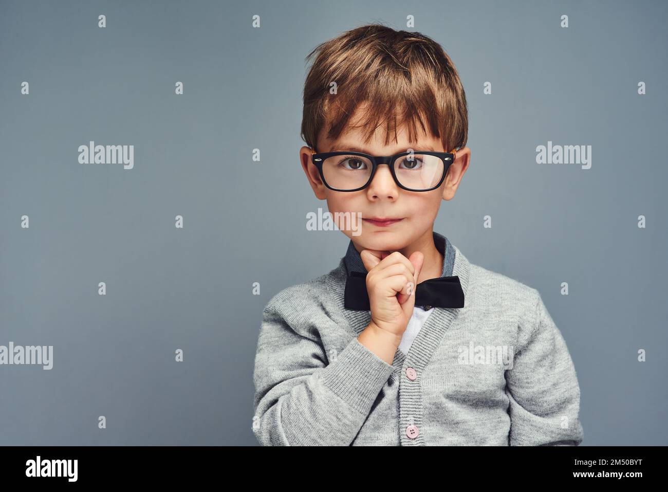 Photo of geek nerd guy dressed denim jacket eyeglasses communicating modern  gadget isolated orange color background Stock Photo - Alamy