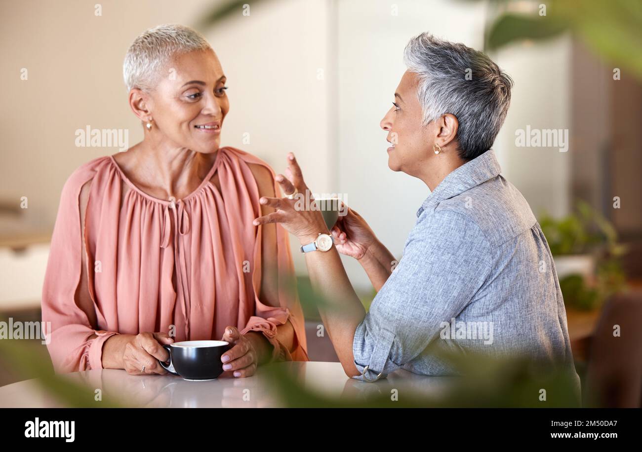 Senior women, friends and talking in cafe, having fun and bonding. Coffee shop, communication and retired elderly females drinking espresso, chatting Stock Photo