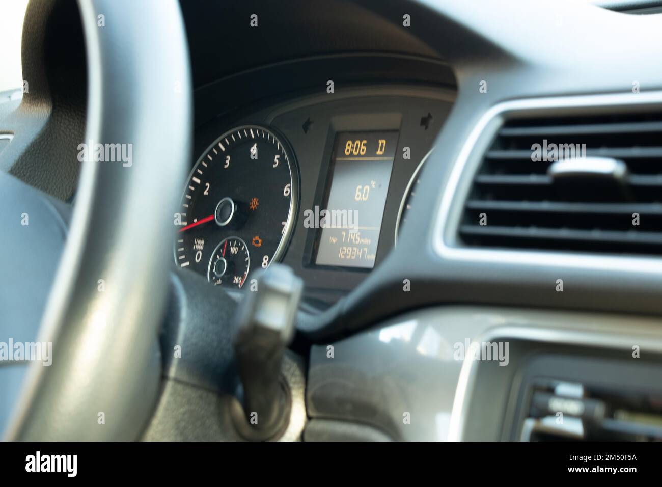 speedometer and steering wheel in auto close-up Stock Photo - Alamy