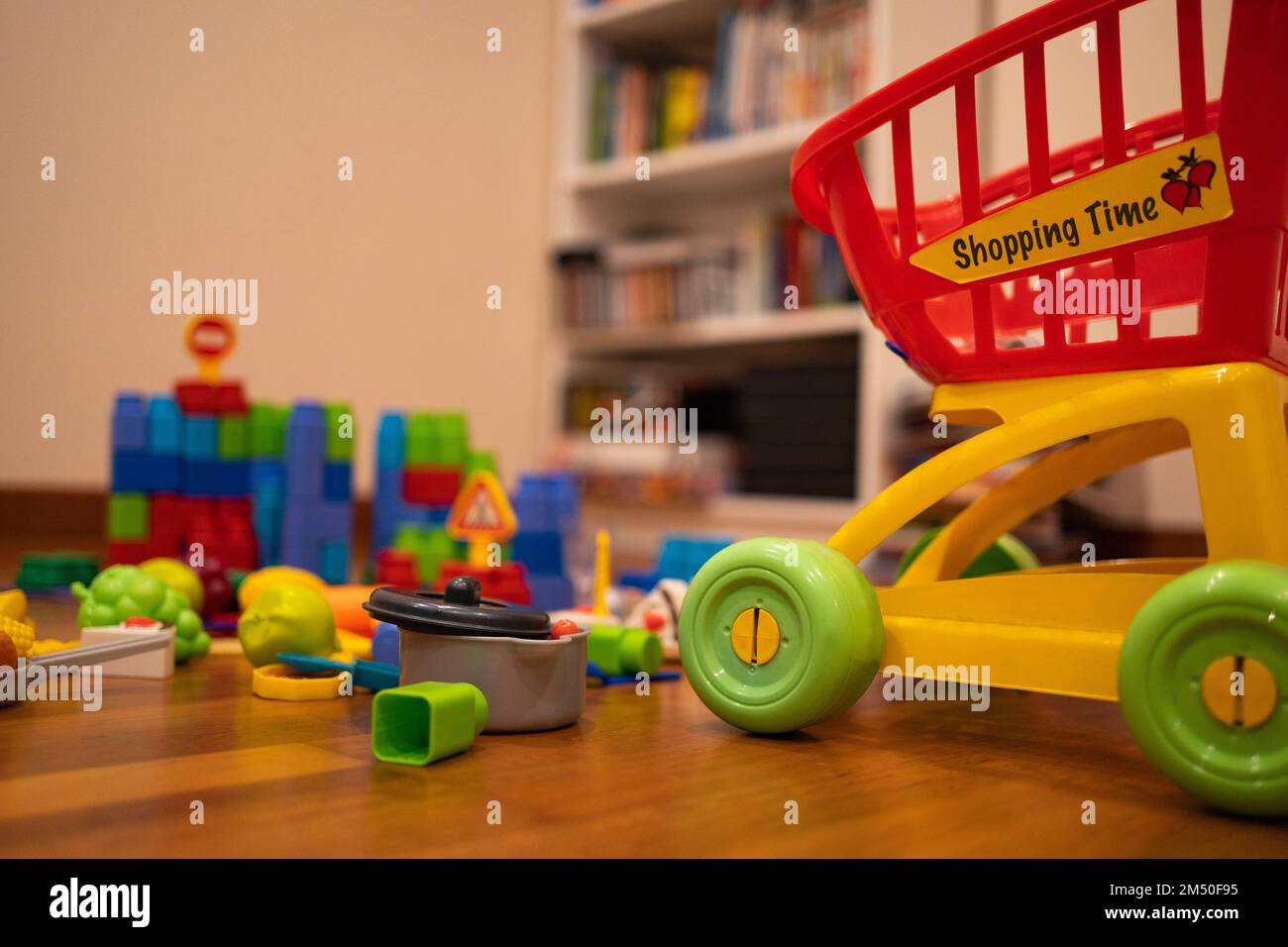 Mess of children toys in the living room at home. Toddlers playroom Stock Photo