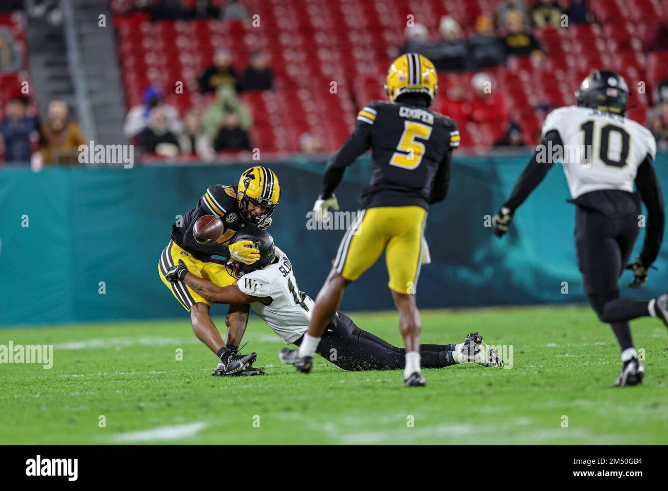 Tampa Bay, FL USA; Wake Forest Demon Deacons defensive back Evan Slocum (14) forces the incomplete pass intended for Missouri Tigers wide receiver Mek Stock Photo