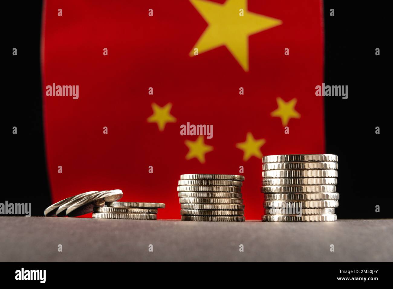 Chinese money on the background of Chinese national flag. Stock Photo