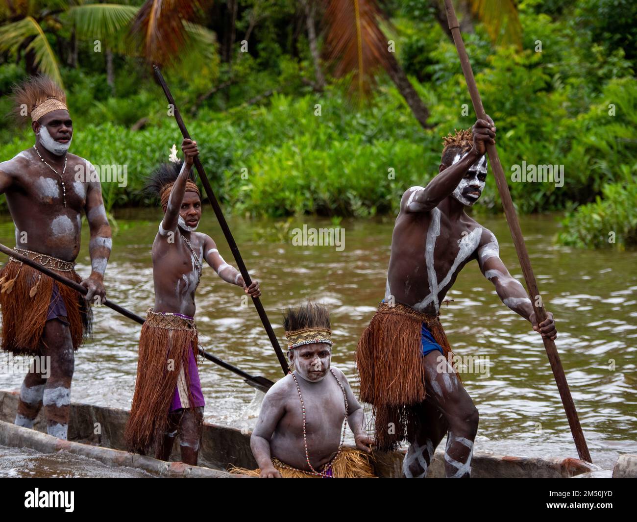 Canoe welcome to the Pem Village in the Asmat region of South Papua, Indonesia Stock Photo